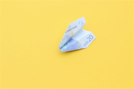 simsearch:400-08891312,k - nice conceptual image of money airplane on yellow background Stock Photo - Budget Royalty-Free & Subscription, Code: 400-06140690