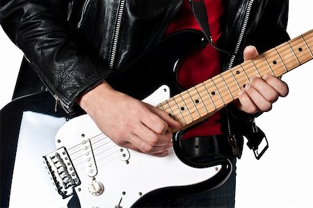 Guitarist playing on electric guitar isolated on white background Stock Photo - Budget Royalty-Free & Subscription, Code: 400-06140791