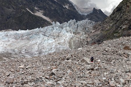 simsearch:400-05118687,k - Hiker on glacier moraine. Caucasus Mountains, Georgia. Stock Photo - Budget Royalty-Free & Subscription, Code: 400-06142273