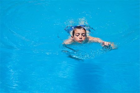 a boy swims in a pool Stock Photo - Budget Royalty-Free & Subscription, Code: 400-06142307