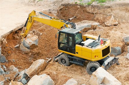 simsearch:400-08791419,k - Heavy Yellow Excavator Moving the Stone Stock Photo - Budget Royalty-Free & Subscription, Code: 400-06142333