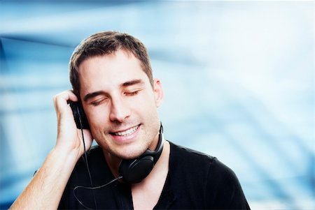 simsearch:400-04300097,k - man listening the music in front of abstract background Stock Photo - Budget Royalty-Free & Subscription, Code: 400-06143156