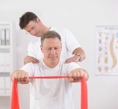 Physiotherapy: Senior man doing exercise under supervision of physiotherapist Stock Photo - Budget Royalty-Free & Subscription, Code: 400-06174287