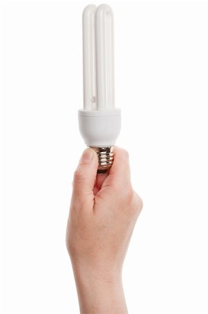 Hand holding energy saving fluorescent light bulb isolated on white background Stock Photo - Budget Royalty-Free & Subscription, Code: 400-06175792