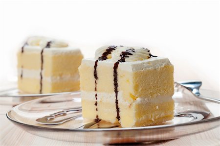 simsearch:400-05173009,k - fresh cream cake closeup with chocolate sauce topping Stock Photo - Budget Royalty-Free & Subscription, Code: 400-06176115