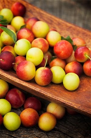 simsearch:400-07096505,k - Fruit garden concept. Freshly harvested wild plum on old wooden background Stock Photo - Budget Royalty-Free & Subscription, Code: 400-06176146