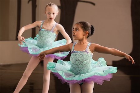 Two adorable children twirling during ballet practice Photographie de stock - Aubaine LD & Abonnement, Code: 400-06172147