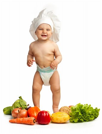 dancing chef - Little boy in chef's hat standing among fresh vegetables against white background Stock Photo - Budget Royalty-Free & Subscription, Code: 400-06173964