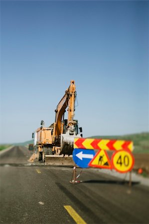 simsearch:400-08791419,k - Excavator working on road construction. Useful file for your article, brochure and other construction related needs. Stock Photo - Budget Royalty-Free & Subscription, Code: 400-06199484