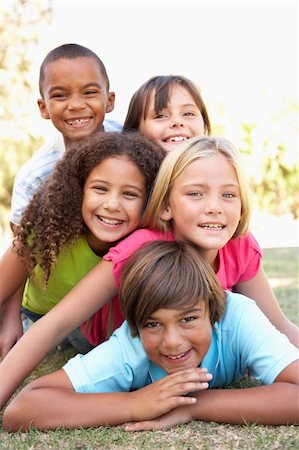 Group Of Children Piled Up In Park Stock Photo - Budget Royalty-Free & Subscription, Code: 400-06204012