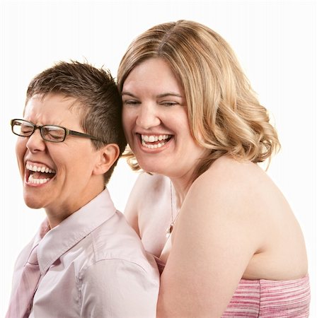 simsearch:400-06204561,k - Two European friends laughing together over white background Stock Photo - Budget Royalty-Free & Subscription, Code: 400-06204564