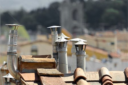 Authentic house roof with lots of tile, vent chimney and boiler vent ducts. Useful file for your site, flyer and brochure. Photographie de stock - Aubaine LD & Abonnement, Code: 400-06205429