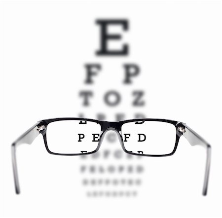 Sight test seen through eye glasses, white background isolated Stock Photo - Budget Royalty-Free & Subscription, Code: 400-06205454