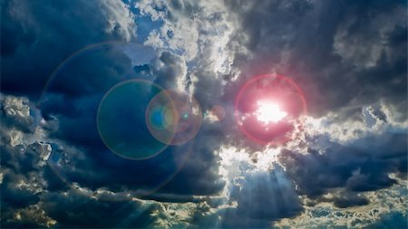 Sunlight on Cloudy sky with flare light Stock Photo - Budget Royalty-Free & Subscription, Code: 400-06206823