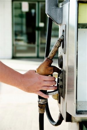 Man hand holding fuel pump Stock Photo - Budget Royalty-Free & Subscription, Code: 400-06207862