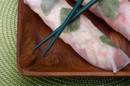 Asian spring rolls in rice paper on a wooden plate. Stock Photo - Budget Royalty-Free & Subscription, Code: 400-06208190
