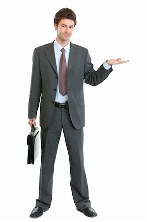 empty suitcase - Businessman with briefcase presenting something on empty hand Stock Photo - Budget Royalty-Free & Subscription, Code: 400-06208516