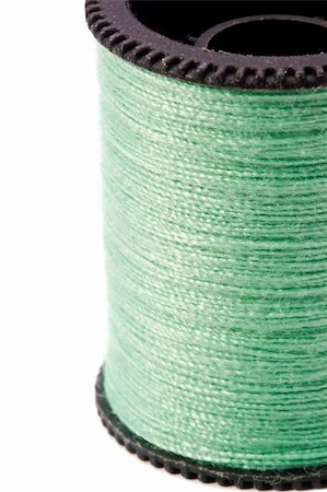 simsearch:400-06079198,k - Close-up photograph of green thread spool on a white background. Stock Photo - Budget Royalty-Free & Subscription, Code: 400-06208591