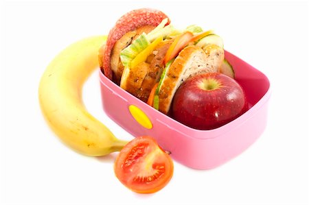 fat kid at school - Lunchbox with banana and tomato isolated over white Stock Photo - Budget Royalty-Free & Subscription, Code: 400-06200731