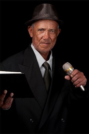 preacher - An elderly gentleman spreads the holy word by means of a microphone. Stock Photo - Budget Royalty-Free & Subscription, Code: 400-06201692