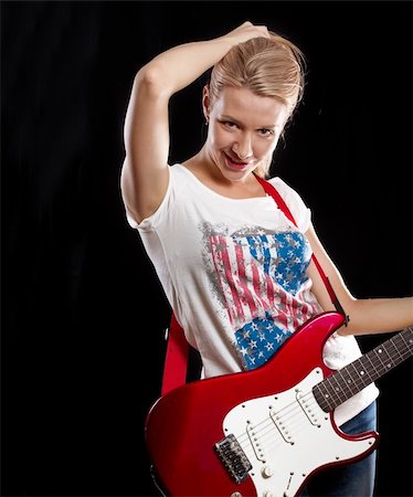 simsearch:400-04652753,k - Woman playing the electrical guitar and have fun Stock Photo - Budget Royalty-Free & Subscription, Code: 400-06202072