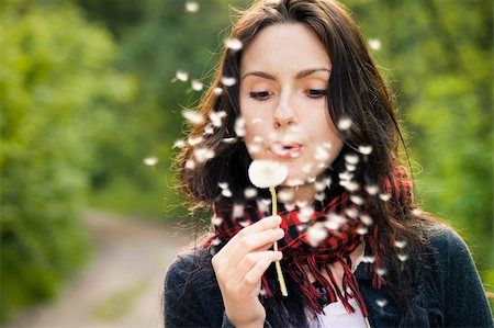 simsearch:400-04399510,k - Girl blowing on white dandelion in the forest Stock Photo - Budget Royalty-Free & Subscription, Code: 400-06202868