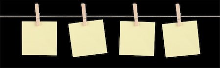 peg - Four blank yellow sticky notes held on a string by pegs isolated on a black background. Stock Photo - Budget Royalty-Free & Subscription, Code: 400-06203502