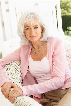 Portrait Of Senior Woman Relaxing In Chair Stock Photo - Budget Royalty-Free & Subscription, Code: 400-06203707