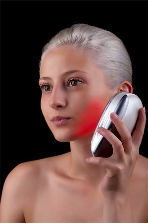 eye laser beam - Young woman getting photo-therapy treatment with red light Stock Photo - Budget Royalty-Free & Subscription, Code: 400-06327813