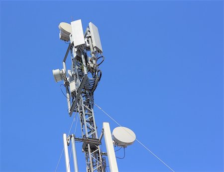 Cellular antenna  against blue sky Stock Photo - Budget Royalty-Free & Subscription, Code: 400-06327977