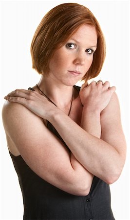 simsearch:400-06363059,k - Serious red head with hands on shoulders over white background Stock Photo - Budget Royalty-Free & Subscription, Code: 400-06328786