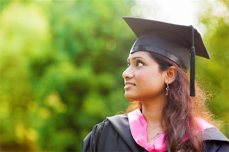 Smiling Young Asian Indian female student looking away with copy space Stock Photo - Budget Royalty-Free & Subscription, Code: 400-06328861