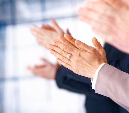 Colleagues applauding during a business meeting, focus on the hands. Stock Photo - Budget Royalty-Free & Subscription, Code: 400-06329105