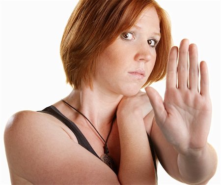 simsearch:400-06363059,k - Scared woman with hand up over white background Stock Photo - Budget Royalty-Free & Subscription, Code: 400-06329274