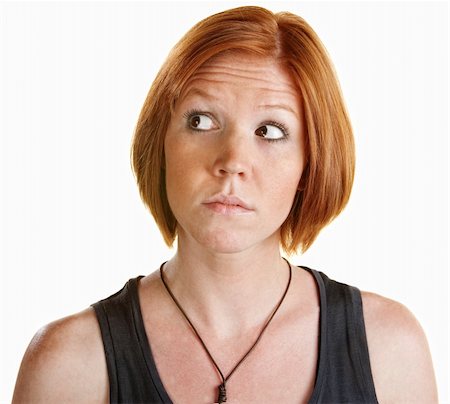 simsearch:400-06363059,k - Skeptical red head female looking over on isolated background Stock Photo - Budget Royalty-Free & Subscription, Code: 400-06329275