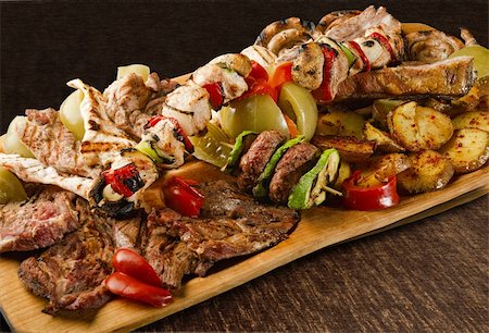 simsearch:400-06079651,k - Rustic tray with various meats, mushrooms and assorted vegetables - isolated Stock Photo - Budget Royalty-Free & Subscription, Code: 400-06329793