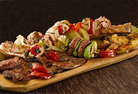 simsearch:400-06079651,k - Rustic tray with various meats, mushrooms and assorted vegetables - isolated Stock Photo - Budget Royalty-Free & Subscription, Code: 400-06329910