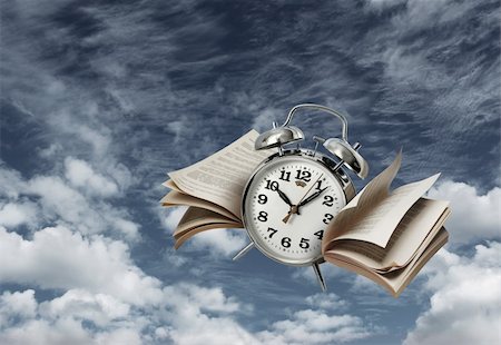 Old alarm clock flying with page wings, time flies concept Photographie de stock - Aubaine LD & Abonnement, Code: 400-06330457
