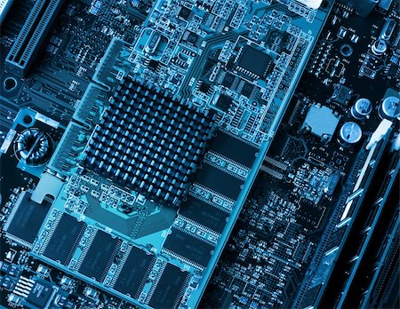 Computer components circuit board and processors closeup blue Stock Photo - Budget Royalty-Free & Subscription, Code: 400-06331197