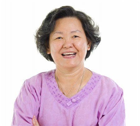 simsearch:400-07221782,k - 60s cheerful Asian senior woman smiling over white background Stock Photo - Budget Royalty-Free & Subscription, Code: 400-06331296