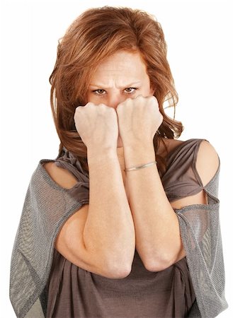 simsearch:400-06363059,k - Angry woman hiding her face behind fists Stock Photo - Budget Royalty-Free & Subscription, Code: 400-06365356