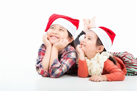 santa children - Happy child in christmas hat isolated on white Stock Photo - Budget Royalty-Free & Subscription, Code: 400-06367559