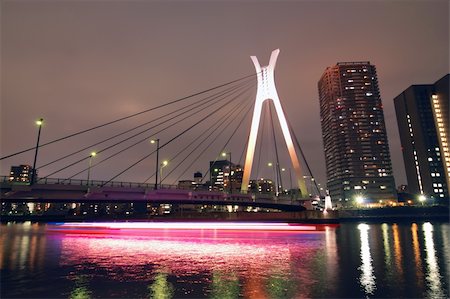 Chuo-Ohashi suspension bridge in Tokyo, Japan with light traces of moving ship Stock Photo - Budget Royalty-Free & Subscription, Code: 400-06362122