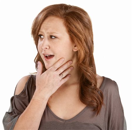 simsearch:400-06363059,k - Awestruck woman with hand on chin over white Stock Photo - Budget Royalty-Free & Subscription, Code: 400-06363056