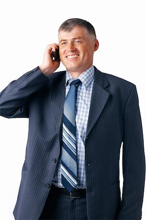 simsearch:400-05145011,k - Smiling mature businessman speaking on the phone on the white background. Stock Photo - Budget Royalty-Free & Subscription, Code: 400-06388428