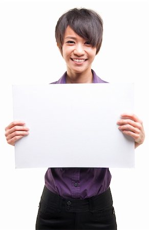 Beautiful cool Asian girl holding a white card board over white background Stock Photo - Budget Royalty-Free & Subscription, Code: 400-06394064