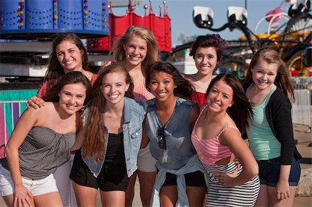 simsearch:400-04099373,k - Group of 8 happy female teens at an amusement park Stock Photo - Budget Royalty-Free & Subscription, Code: 400-06394226