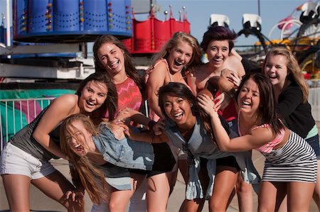 simsearch:400-04099373,k - Giggling group of teenage girls at a theme park Stock Photo - Budget Royalty-Free & Subscription, Code: 400-06394227