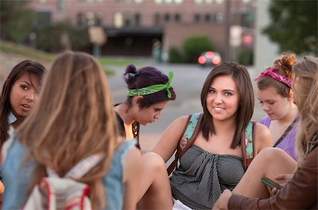 simsearch:400-04099373,k - Smiling teenage student with group of friends on campus Stock Photo - Budget Royalty-Free & Subscription, Code: 400-06394274