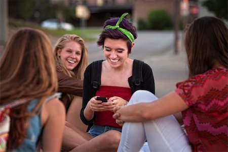 simsearch:400-04099373,k - Teenager and friends playing with a cell phone Stock Photo - Budget Royalty-Free & Subscription, Code: 400-06394279